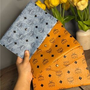 MCM Clutch ( Buyers Choice of ONE)